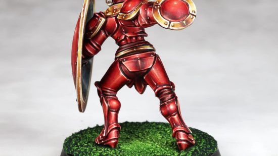 Warhammer Age of Sigmar Shovel Knight mini conversions - creator photo showing the rear side of the fully painted shield knight mini