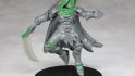 Warhammer Age of Sigmar Shovel Knight mini conversions - creator photo showing a work in progress stage of the specter knight mini, with grey plastic and green stuff