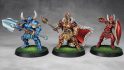 Warhammer Age of Sigmar Shovel Knight mini conversions - creator photo showing the shovel knight, king knight, and shield knight minis fully painted and based