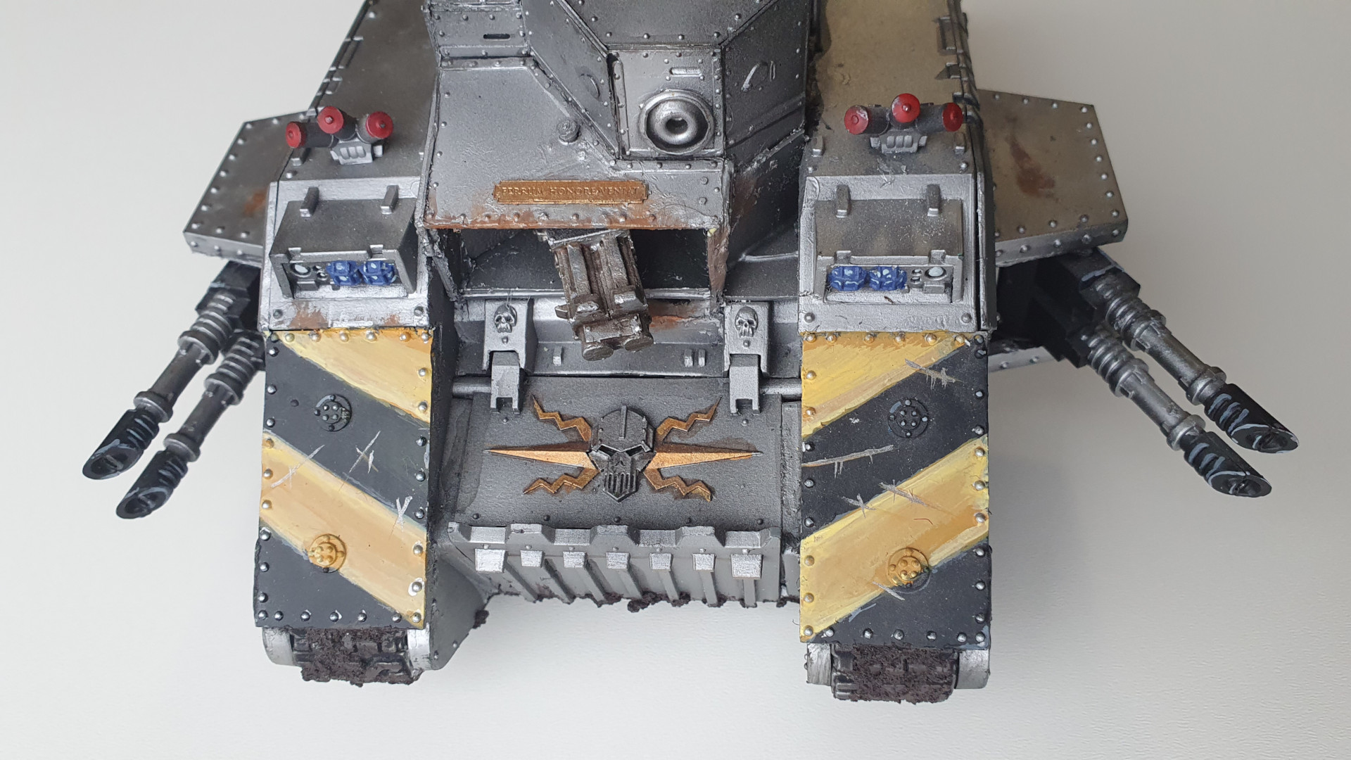 Iron Warriors Land Raider - a heavy assault vehicle with silver armour, massive sponson mounted lascannons, and hull modifications