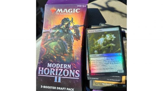 MTG cards landfill - an opened 3-booster draft pack for MTG Modern Horizons 2