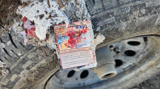 MTG card on a tire in a landfill