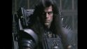 Warhammer 40k film from the 1980s, as imagined by an AI - Corvus Corax, a handsome man with long black hair in cheap looking armour