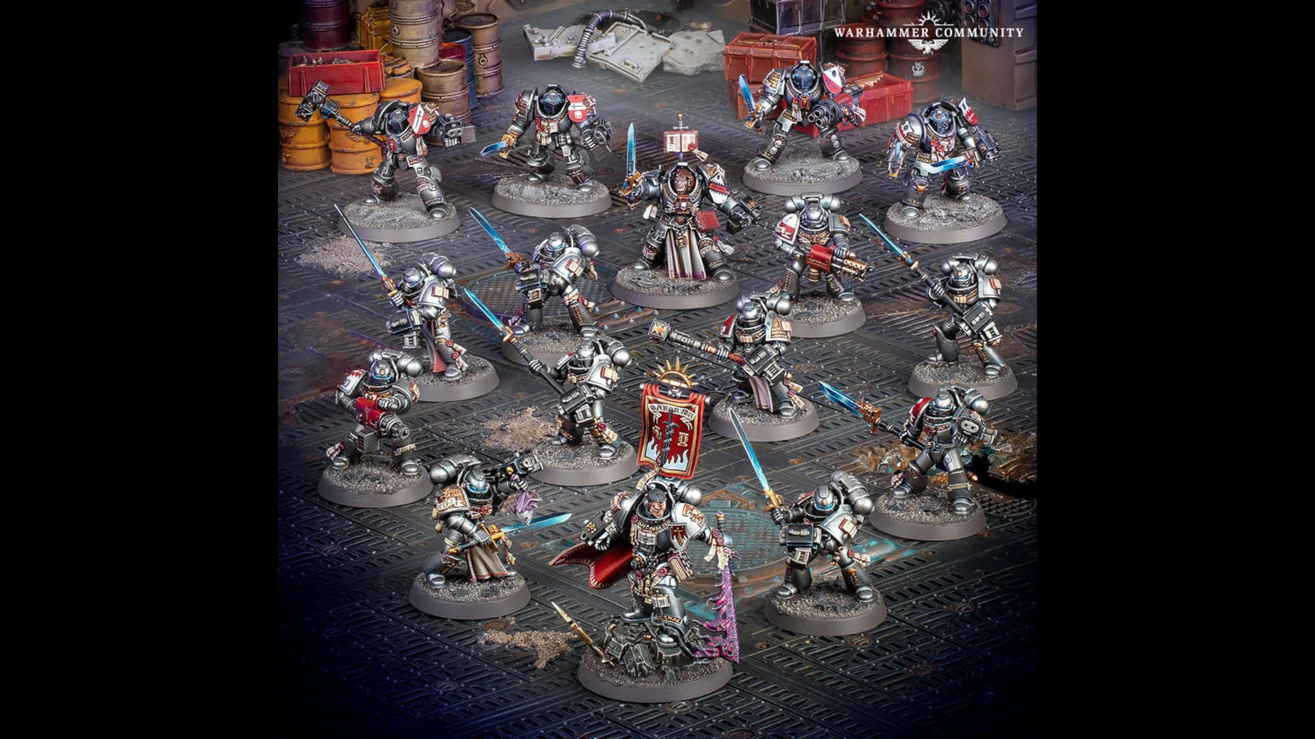 Warhammer 40k Grey Knights boarding patrol - a force of silver armoured space marines wielding glowing blue weapons advance into a space ship - models and photographs by Games Workshop