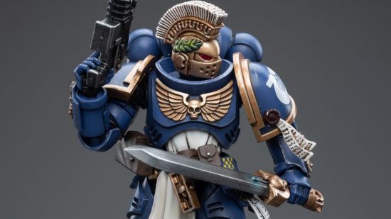 Warhammer 40k Space Marine Primaris Champion figure by JoyToy - a 1/18 scale action figure of a Blue Armoured space marine with a gold helmet, horeshair crest, power sword and bolt pistol, in a ready pose