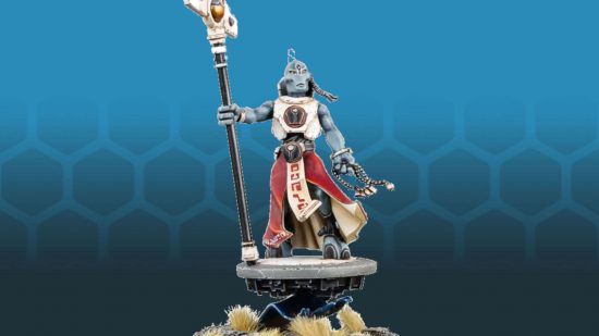 Warhammer 40k Tau Empire list wins competition for Worst Army - Tau Ethereal product photograph by Games Workshop, a grey-skinned humanoid in robes on a hovering dais holding a staff