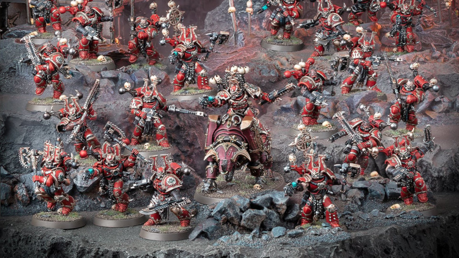 Warhammer 40k World Eaters Codex Review - combat patrol photograph by Games Workshop, a horde of red-armoured warriors led by a lord on a daemonic rhino steed