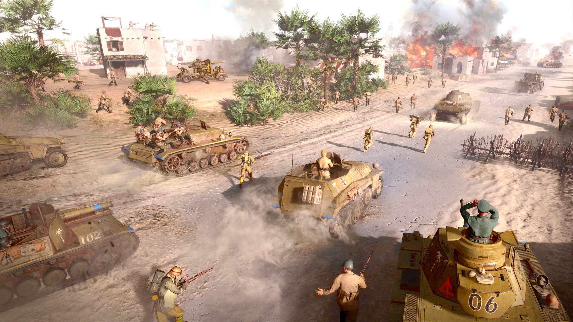 best RTS games guide - Official SEGA screenshot from Company of Heroes 3 showing various Deutsche Afrika Korps (DAK) units advancing together for an attack in a North African battlezone