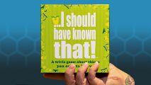 Broken board games sell - product photo of I Should Have Known That held by a hand