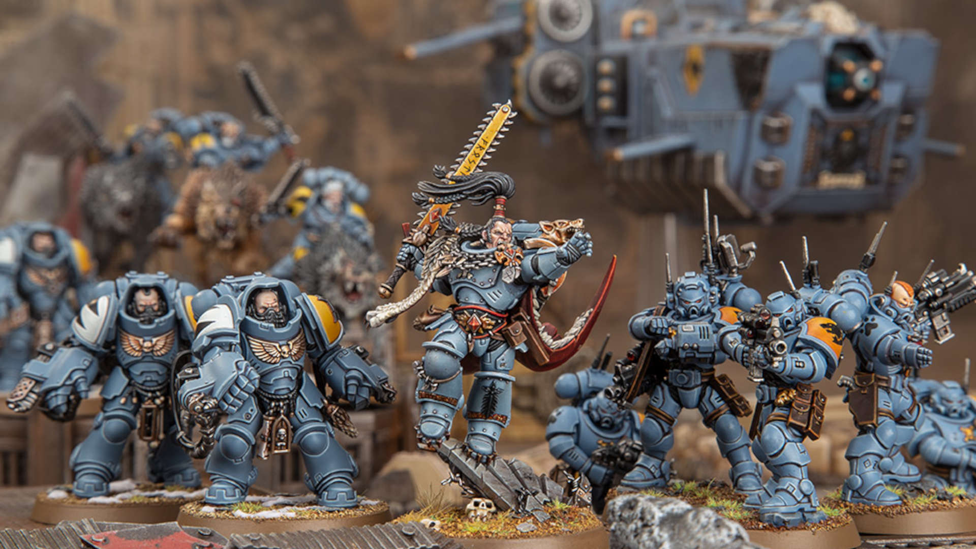 Warhammer 40k Space Wolves - a force of Primaris Space Wolves led by Ragnar Blackmane,a bounding warrior with a huge yellow sword and a topknot of black hair