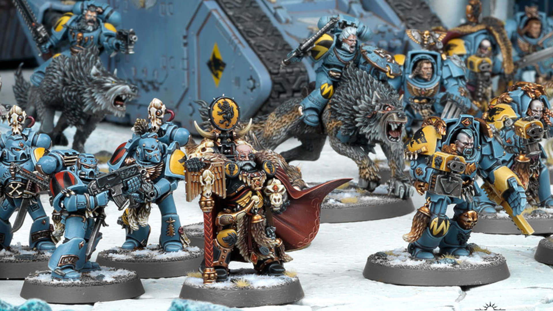 Warhammer 40k Space Wolves - Ulrik the slayer, a black-armoured Wolf Priest, rests his hand on his crozius staff - around him are veteran warriors, some in terminator armour, others riding wolves