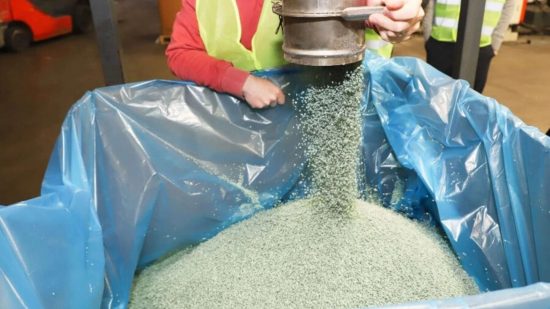 Warhammer recycling partner TerraCycle's photograph of recycled plastic pellets pouring into a container