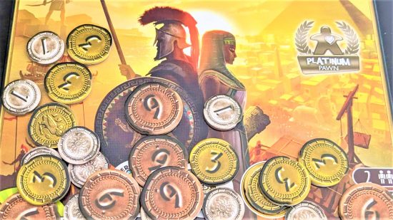 Coin tokens on the box of Seven Wonders Duel, one of the best couples' board games