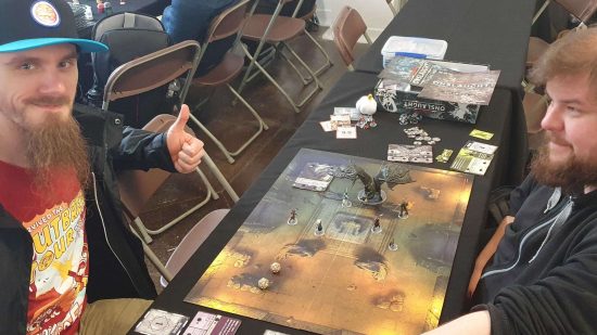 DnD Onslaught starter set review - two members of the public playing the game at WASD expo