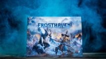 Frosthaven board game on misty blue background