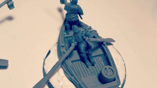 NonCombatTabletop games are like Warhammer without the war - photo by Matt Farmer of a work in progress model, two peasants rowing a boat