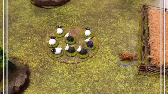 Herding28 is a pacifist alternative to Warhammer - image by Kai Be of a model diorama, a red dog herding a flock of sheep