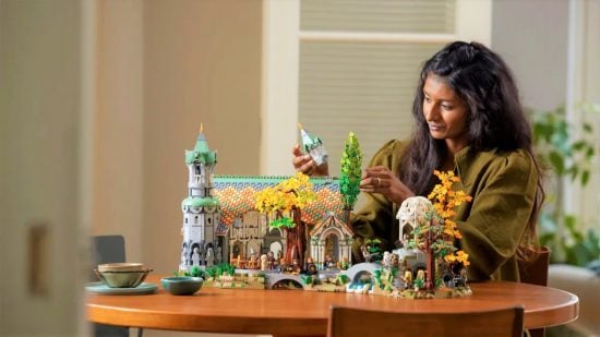 Best Lego sets - A woman creating the Lego Rivendell set.