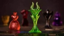 Disney Villainous review - game counters from Villainous board game depicting Maleficent and the Queen of Hearts