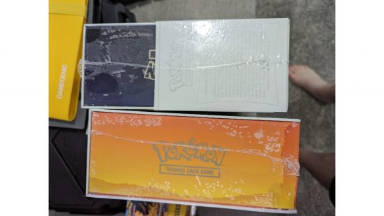 Pokemon TCG flood ruins collection - photo of two water-damaged booster boxes