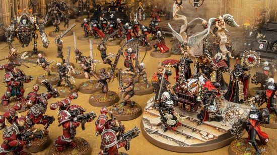 Warhammer 40k 10th edition Sisters of Battle army diorama by Games Workshop - chainsaw wielding Sisters Repentia charge to battle alongside the Triumph of Saint Katherine, piling into Word Bearers Chaos Space Marines