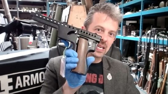 Still from the Gamespot video "Firearms Expert Reacts to Warhammer 40k Boltgun" - Weapons expert Jonathan Ferguson of the Royal Armouries Museum shows a Gyrojet pistol
