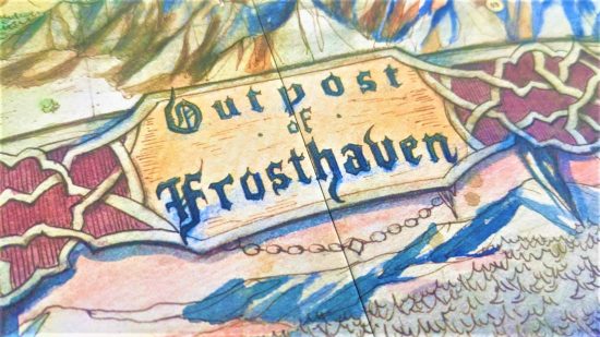Frosthaven review - photo of part of the board game board for Frosthaven, showing text that says 'outpost of Frosthaven'
