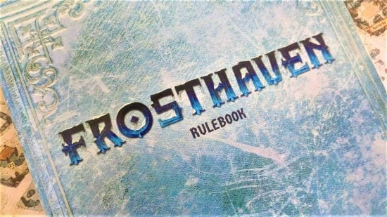 Frosthaven review - photo of the rulebook from the Frosthaven board game