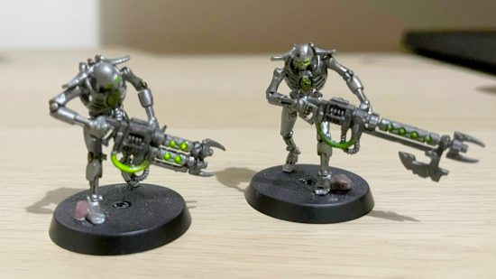 Warhammer 40k 10th edition painting minis with a tremor - author photo showing two Necron Warrior models painted in Sautekh dynasty colors