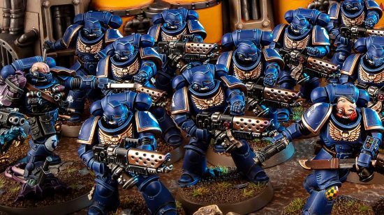 Interview with Warhammer 40k studio manager Stuart Black about Warhammer 40k 10th edition - product photo by Games Workshop of a Space Marine Infernus Squad, warriors in power armor wielding flamethrowers