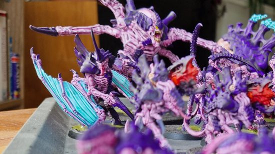 Warhammer 40k Leviathan Tyranids with Citadel Contrast Paints - Author photo showing the Leviathan Tyranids Winged Tyranid Prime model in a crowd of purple Tyranids