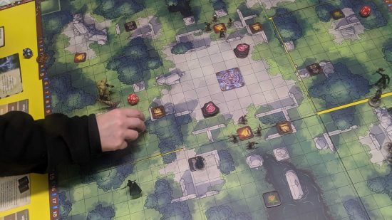 DnD Trials of Tempus review - photo of a player moving tokens on a board game board