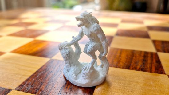 How to 3D print miniatures guide - author photo showing a werewolf model printed using the Ankermake M5 FDM printer