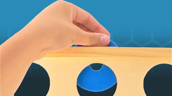 How to win Connect 4 - a hand placing a connect four checker
