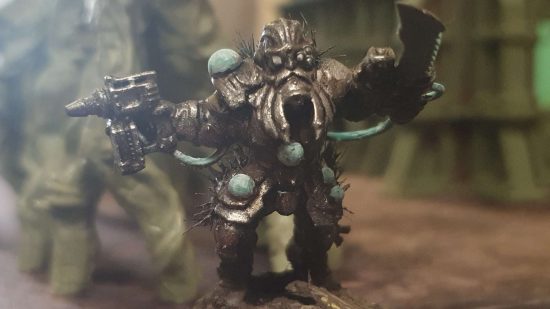 The doomed review - a converted warrior with a metal facemask and strange blue orbs