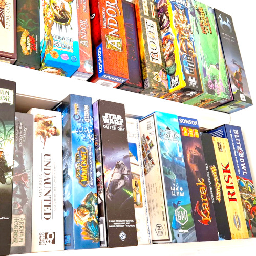 Board games news - Wargamer photo showing two shelves full of board games