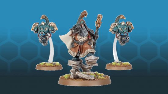 Warhammer 40k psykers - Leagues of Votann Grimnyr, a cowelled, bearded dwarf walks on floating rocks, flanked by hovering robots with dangling guns