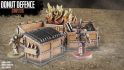 Warhammer 40k terrain from the Donut Defence Kickstarter - several dumpsters, one on fire