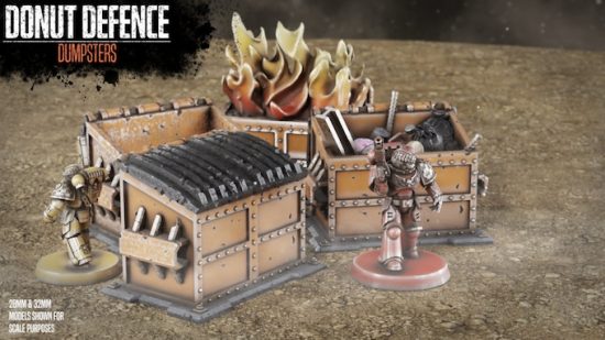 Warhammer 40k terrain from the Donut Defence Kickstarter - several dumpsters, one on fire