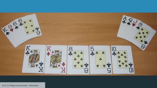 An example of an Omaha Poker showdown - two hands of four hole cards presented alongside five community cards. Photograph by Migg, via Wikimedia