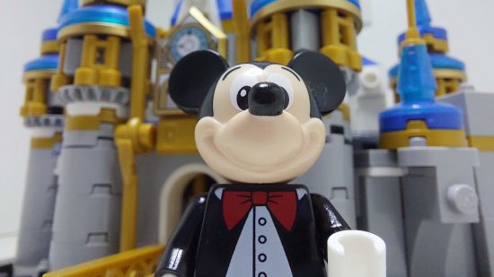 Lego Mini Disney Castle review image showing Mickey standing in front of his castle.