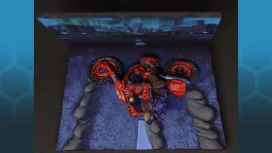 A Warhammer 40k Genestealer Cult Atalan Jackal converted to look like Kaneda from Akira by Paul Michel - a converted Warhammer 40k figure recreates the cell in Akira in which Kaneda skids to a halt on his motorbike in the centre of the road, raising plumes of dust, photographed from above to reveal the forced perspective of the diorama stand