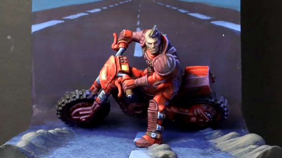 A Warhammer 40k Genestealer Cult Atalan Jackal converted to look like Kaneda from Akira by Paul Michel - a converted Warhammer 40k figure recreates the cell in Akira in which Kaneda skids to a halt on his motorbike in the centre of the road, raising plumes of dust