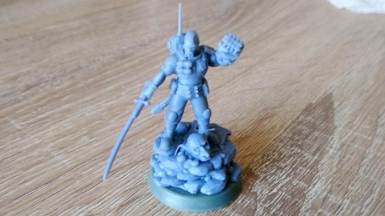 Unofficial Warhammer 40k mini to support Ukraine - author photo showing the commemorative mini unpainted, from the front
