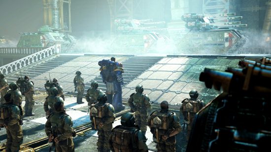 Warhammer 40k Space Marine 2 - a Space Marine and Imperial Guard watch as tanks parade past