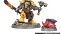Warhammer Age of Sigmar Orruk Ironjawz Zoggrok Anvilsmasha details - detail photographs of a hulking greenskin in beaten metal armor, wielding a hammer and glowing metal sword, accompanied by a small red animal with a flat stony head