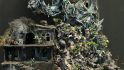 Warhammer Art in Miniature exhibition - detail of a huge diorama by Laurence Senter, a chaotic hillside covered in details and ghosts
