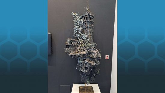 Warhammer Art in Miniature exhibition - a huge floating tower surrounded by ghosts, assemblage by Laurence Senter