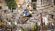 Warhammer the Old World - a High Elf wizard in blue and white robes stands atop a pillar in a crumbling tower
