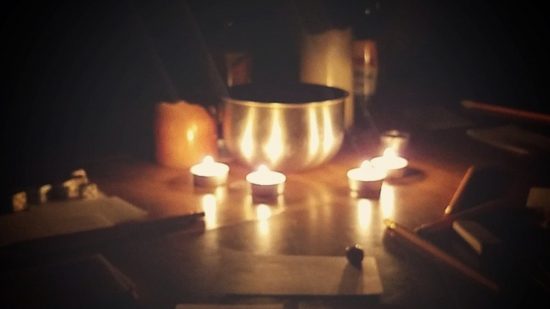 Best Horor RPG games for tabletop guide - Ten Candles photo showing the game set up in a darkened room with lit candles